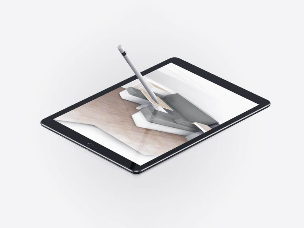 stylus poised over a tablet making design drawings of furniture