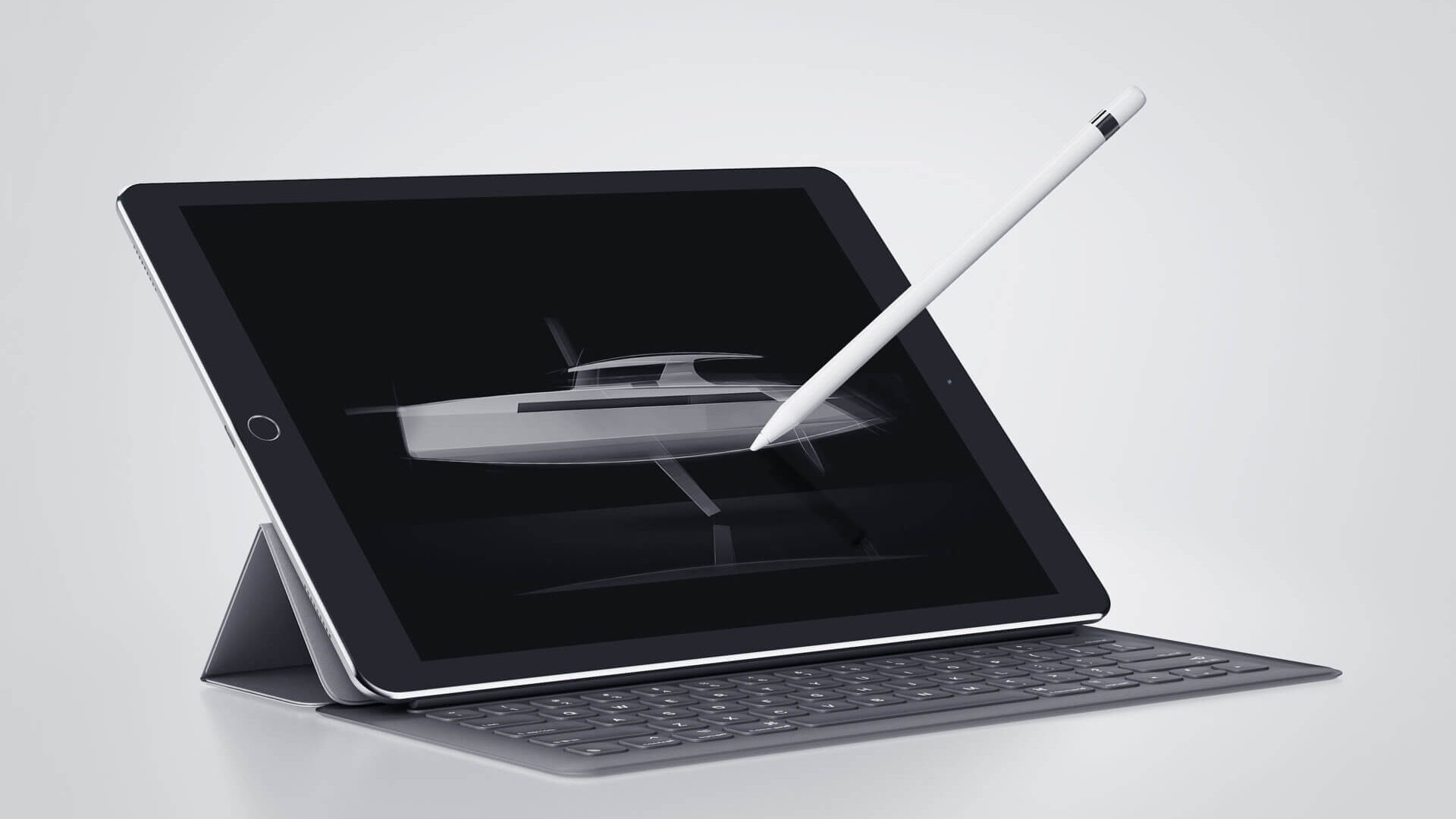 stylus poised over tablet making design drawings of a boat